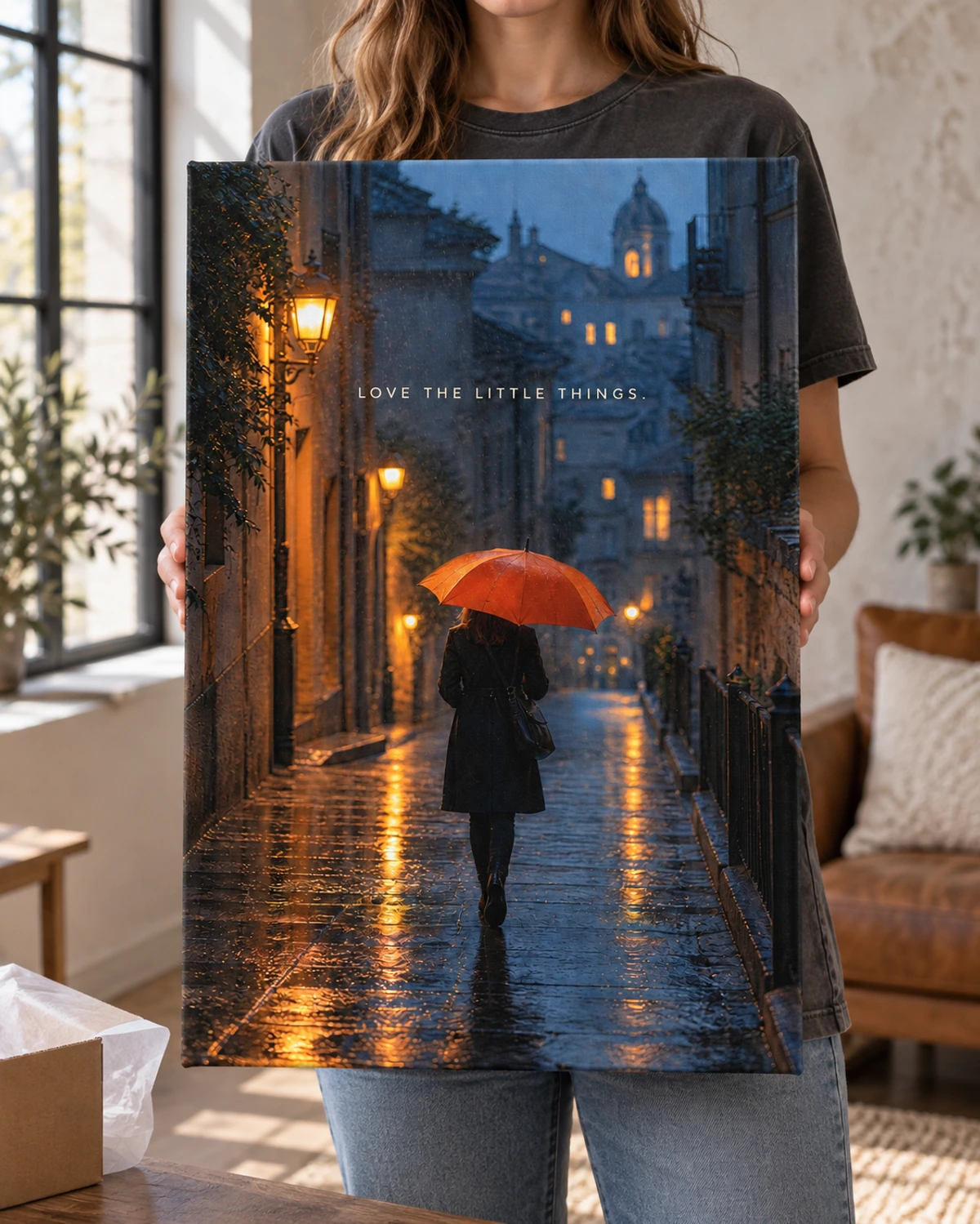 Love The Little Things stretched canvas held after unpacking in a naturally lit home