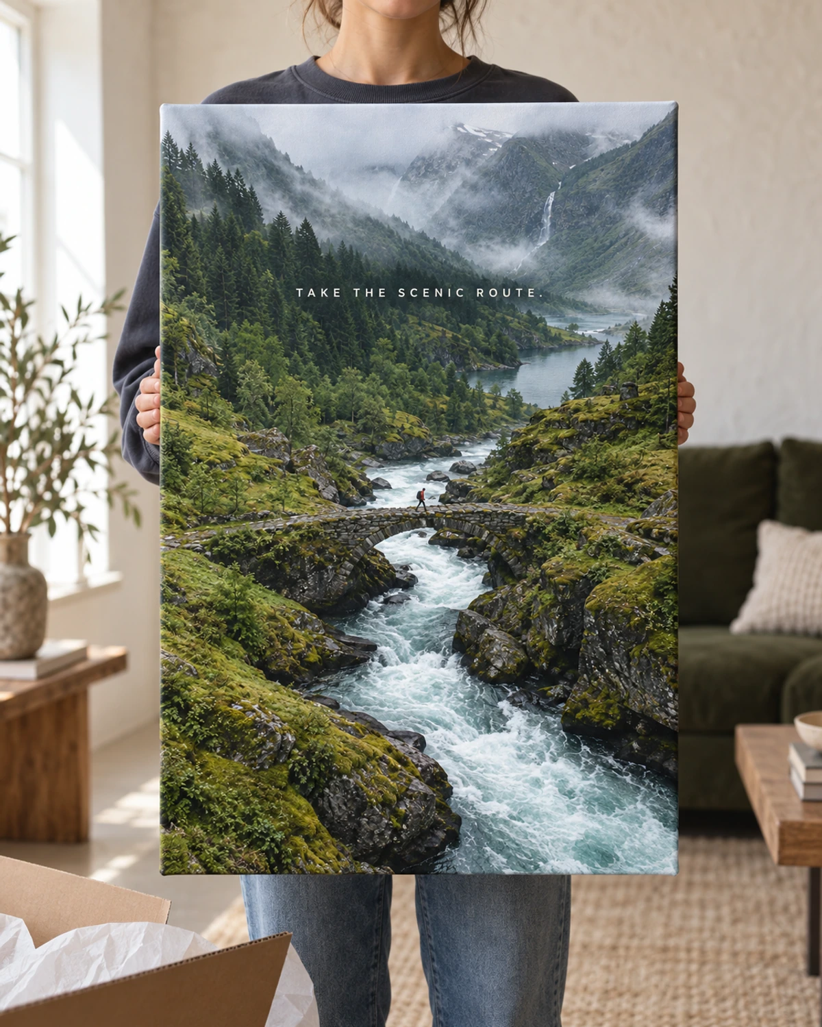 Take The Scenic Route stretched canvas held after unpacking in a naturally lit home